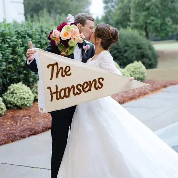 Jaclyn and Alec with their pennant
